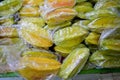 Starfruits in transparent plastic Royalty Free Stock Photo