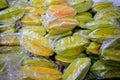 Starfruits in transparent plastic Royalty Free Stock Photo