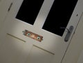 staring eyes peering through door letterbox Royalty Free Stock Photo