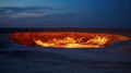 Staring into the flaming gas crater known as the Door to Hell In Darvaza, Turkmenistan