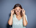 Staring young woman looking over glasses Royalty Free Stock Photo