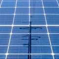 Energy Transition - Power Line Shadow on Solar Panel Royalty Free Stock Photo