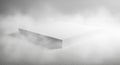 White Rectangular Platform Emerging from Fog on Wooden Surface abstract background Royalty Free Stock Photo