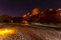 Starlight sky over illuminated desert, night panorama, Hegra, Al Ula, Saudi Arabia Royalty Free Stock Photo