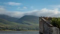 Starlings on Derelict House on the River Lee with Mountains, Tralee