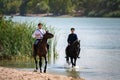 STAROCHERKASSK, RUSSIA - CIRCA SEPTEMBER 2020: two young Don Cossack on horseback Royalty Free Stock Photo