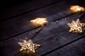 Starry Christmas lights on a gray wooden background