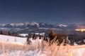 Starry mountain landscape at night. Scenic winter mountains. Tatra mountains in Zakopane, Poland. Beautiful snowy nature