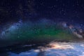 Blue bright starry sky Aurora borealis green dramatic clouds ,  milky way glow  light universe nebula  cosmic background Royalty Free Stock Photo