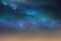 Starry night blue sky on pink sunset nebula Aurora borealis milky way dramatic clouds cosmic space weather background