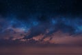 Starry night blue sky on pink sunset nebula Aurora borealis milky way dramatic clouds cosmic space weather background