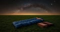 Starry Night Camping Scene in a Grassy Field Royalty Free Stock Photo