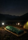 Starry Night Camping Scene in Mountains Royalty Free Stock Photo