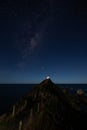 Starry night at Nugget Point Lighthouse, New Zealand, under the Milky Way Royalty Free Stock Photo