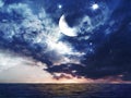 Ocean   Blue night  starry sky  moon on sunset fluffy dramatic clouds at  water wave reflection at sea nature landscape background Royalty Free Stock Photo