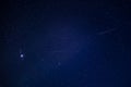 Starry night sky with meteor shower and orion constellation Royalty Free Stock Photo