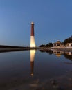 Starry night sky over the Barnegat Lighthouse on the Jersey shore. Royalty Free Stock Photo