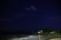 Starry night sky over calm sea beach Royalty Free Stock Photo