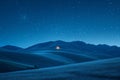 Starry night sky over a grass field with mountains in the background, AI-generated. Royalty Free Stock Photo