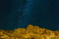 Starry Night Sky over Rocky Landscape at night Royalty Free Stock Photo