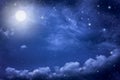 Starry night sky with stars and moon in cloudscape background Royalty Free Stock Photo