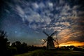 Starry sky above an old wooden windmill Royalty Free Stock Photo