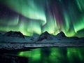 Starry sky with bright Northern lights over mountains at night. Polar landscape with Aurora borealis Royalty Free Stock Photo