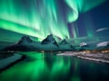 Starry sky with bright Northern lights over mountains at night. Polar landscape with Aurora borealis Royalty Free Stock Photo