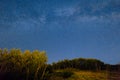 The starry sky and the Milky Way over the mountains and the fore Royalty Free Stock Photo