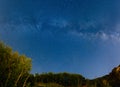 The starry sky and the Milky Way over the mountains and the fore Royalty Free Stock Photo