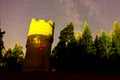 Starry sky over the forest and the water tower. Starry sky backg Royalty Free Stock Photo