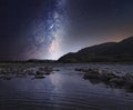 Starry sky over mountain river