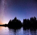 Starry sky over the sea. Fantastic Milky Way. Meteor shower Royalty Free Stock Photo