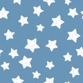 Starry sky seamless pattern. White stars on a blue background. Vector simple childish hand-drawn background in cartoon style. Royalty Free Stock Photo