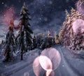 Starry sky in winter snowy night. fantastic milky way in the New Year`s Eve. Winter road in the mountains. Bokeh light Royalty Free Stock Photo