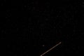 Stars astronomy long exposure aeroplane flight path yellow and red nighttime night dark