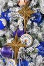 Stars and Christmas toys hang on a Christmas tree Royalty Free Stock Photo