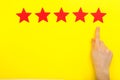 5 stars increase rating, customer experience concept. Hand of client show putting 5 star symbol to increase Service rating. five Royalty Free Stock Photo