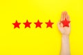 5 stars increase rating, customer experience concept. Hand of client show putting 5 star symbol to increase Service rating. five Royalty Free Stock Photo