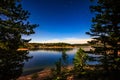 Stars and Lake by Moonlight at Rampart Reservoir Royalty Free Stock Photo