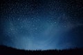 Stars in night sky. Blue dark night sky with many stars above field of grass. Shining Stars and Clouds. Background