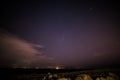 Stars over Galway and lighthouse