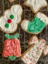 Colorfully iced, homemade Christmas cookies on a wire rack