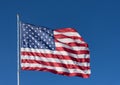 The stars and stripes of the American flag against a deep blue sky. Royalty Free Stock Photo