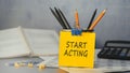 Start Acting - concept of text on sticky note. Work and study concept Royalty Free Stock Photo