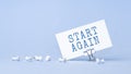 Start Again - concept of text on business card. Work and study concept Royalty Free Stock Photo