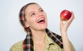 Start apple diet. Woman likes natural fruits. Farmer gardener apple harvest. Girl gardener rustic style hold apple white
