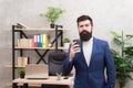 Start awesome working day. Man bearded manager businessman entrepreneur hold cup of coffee. Relaxed thoughtful top Royalty Free Stock Photo