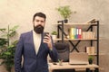 Start awesome working day. Man bearded manager businessman entrepreneur hold cup of coffee. Relaxed thoughtful top Royalty Free Stock Photo