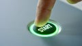 Start button glowing green light press activation control Royalty Free Stock Photo